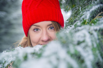 Portrait of a beautiful girl in a red hat. Happy winter time. 