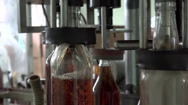 Semi-automatic bottling line in the rum factory. Pinar del Rio, Cuba