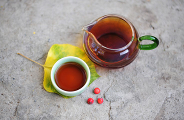 Chinese tea ceremony - glass tea pot with black tea and ceramic cup
