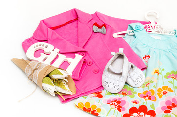 Set of clothes for the little girl. Pink jacket, dress, booties.