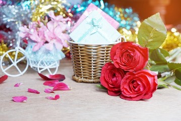 red rose bouquet and gifts beautifully arranged on a table for Valentine's Day