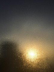 Fototapeta na wymiar Blurry defocused abstract foggy window water drops background. Closeup