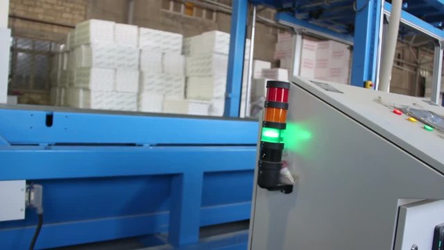 Flasher light of control panel of a conveyor in styrofoam factory. Flasher of control panel