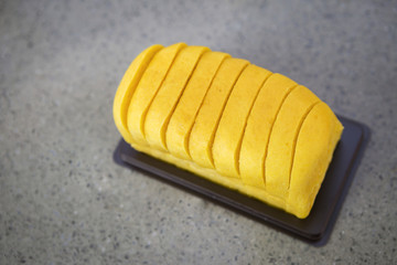 Fresh pumpkin bread on grey marble table