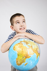 School boy with world globe