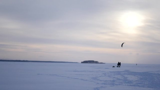 fishermen go home in the background passes kitesurfing, 4k