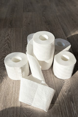 Toilet paper on wood background