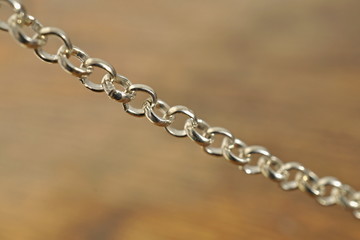 Fototapeta premium Macro detail of a fashionable chain used as decorate accessory as necklace or bracelet