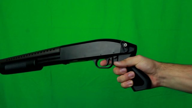 Holding Shotgun With One Hand Realoading And Shooting