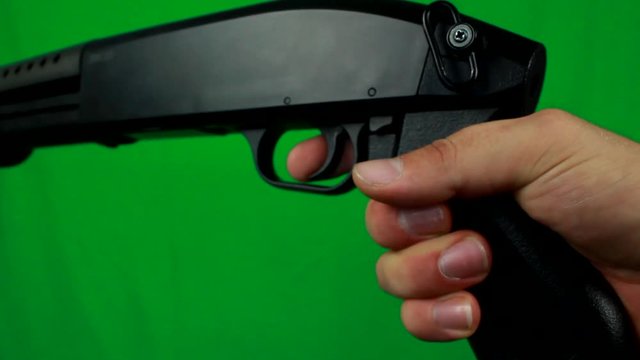 Putting Finger On A Trigger And Holding Shotgun