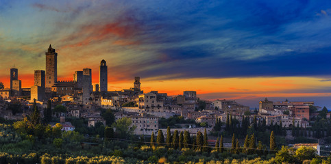 Amazing sunset panoramic view of towers of old town San Giminian