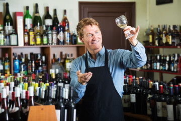 Seller man in wine store