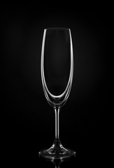 Empty wine glass on dark red