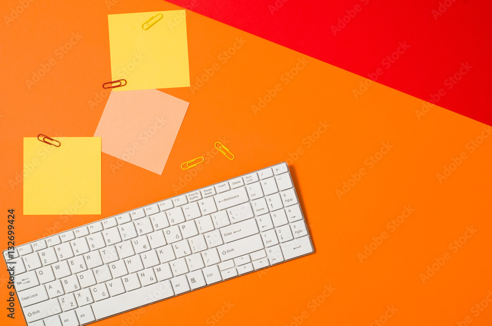 Poster sticky notes reminder on colorful office table or desk seen from above. top view product photograph.