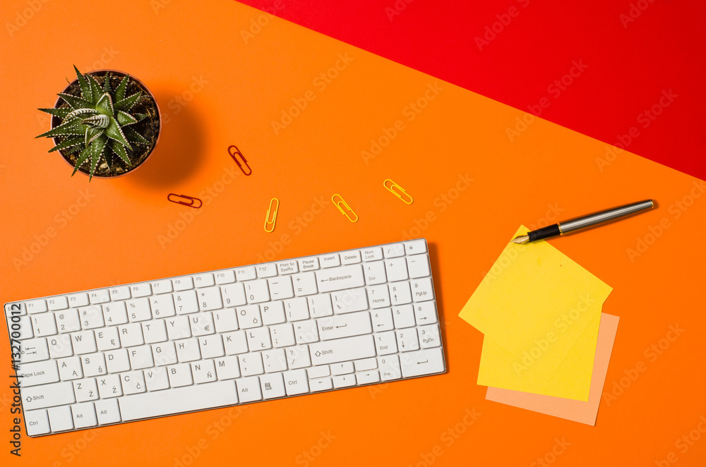 Poster computer workspace with keyboard on colorful office table or desk seen from above. top view product 