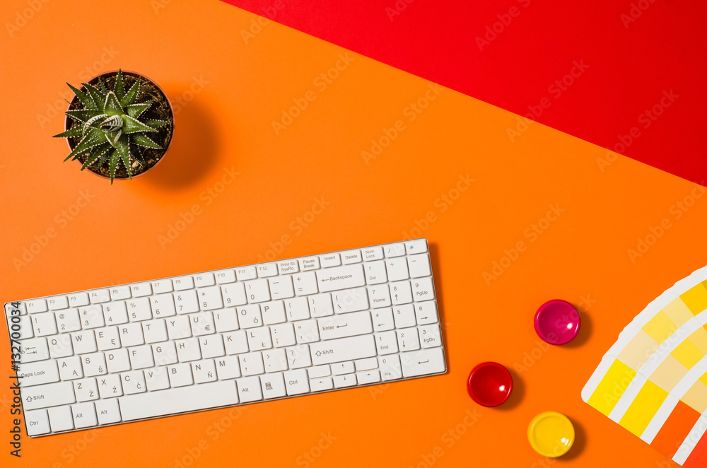 Poster computer workspace with keyboard on colorful office table or desk seen from above. top view product 