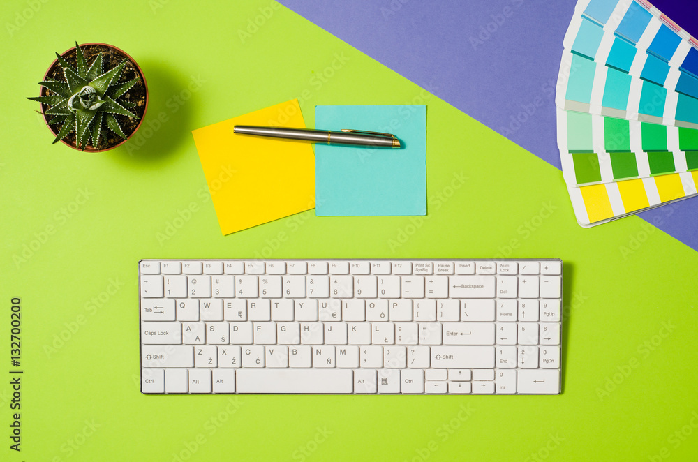 Poster computer workspace with keyboard on colorful office table or desk seen from above. top view product 