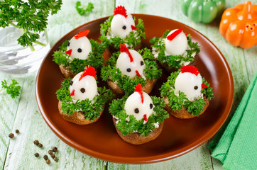 Funny chickens from eggs on the Easter table