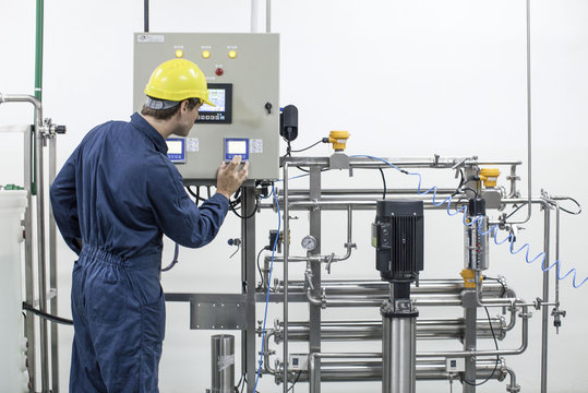 Worker operating industrial equipment