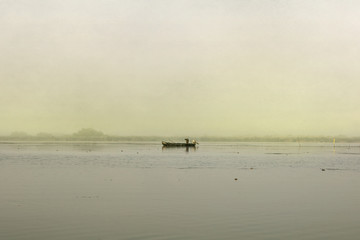 Fototapeta na wymiar Fishing boat early in the morning at sunrise