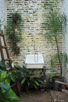 Old sink on brick background