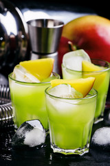 Alcoholic cocktail Aztec, with gold tequila, blue curacao liqueu