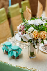 beautiful wedding decorations of flowers on a table in the restaurant