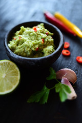 Bowl of guacamole with fresh ingredients
