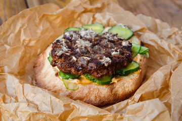 Classic american burger, fast food on wood background