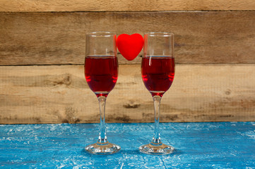 Two glasses with Red Wine on Old Wooden Background. Holiday Vale