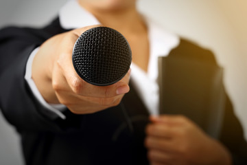 woman making speech with microphone