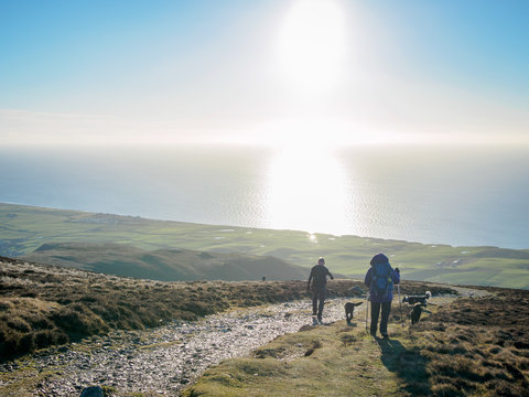 Family Enjoying Hiking On Black Combe In The Lake District, Overlooking The Irish Sea