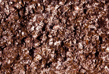 Old brown stone texture with moss.
