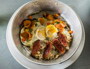 Eggs pan with pork roast