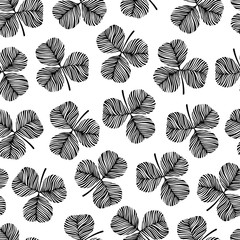 Trendy monochrome seamless pattern with clover leaves.