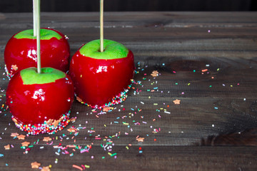 candy apples on wooden table