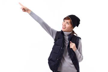 happy traveling woman traveller pointing up, studio isolated