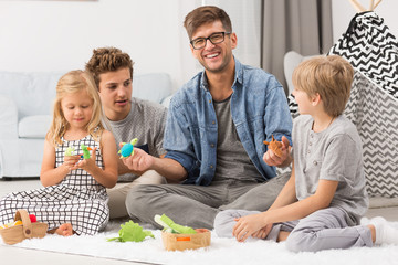 Family playing with puppets