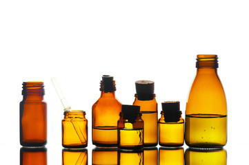 Various medicine glass bottles on the white background