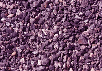 Pile of magenta toned gravel stones.