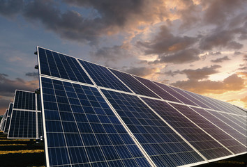Solar panels with morning cloudscape background
