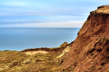 A view of the beach and surrounding rock at the North Landing at Flamborough Head on the north Yorkshire coast.