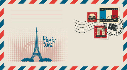 an envelope with a postage stamp with Arc de Triomphe, the Eiffel tower and the flag of France