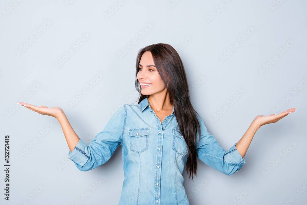 Poster attractive smiling brunette woman showing balance with hands