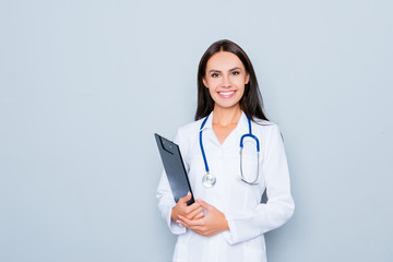 Portrait of young happy smiling pediatrician holding folder