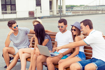 happy successful young  boyfriends and girlfriends talking and l