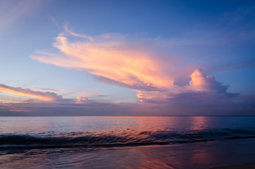 Beautiful beach light at dawn with dramatic sky