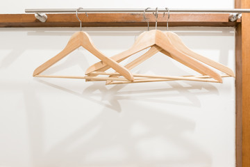 Fototapeta na wymiar wooden cloth hanger on white wall