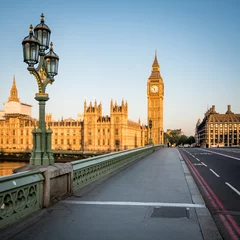 Fotobehang Big Ben and the Palace of Westminster. Low angle view of the famous clock tower London landmark in the early morning sun. © pxl.store