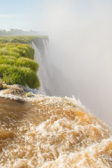 Iguazu (Iguacu) falls, largest series of waterfalls on the planet, located between Brazil,...